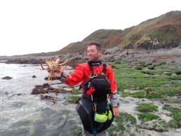 Sea Kayak Coach James Roberts Holding a Cornish King crab